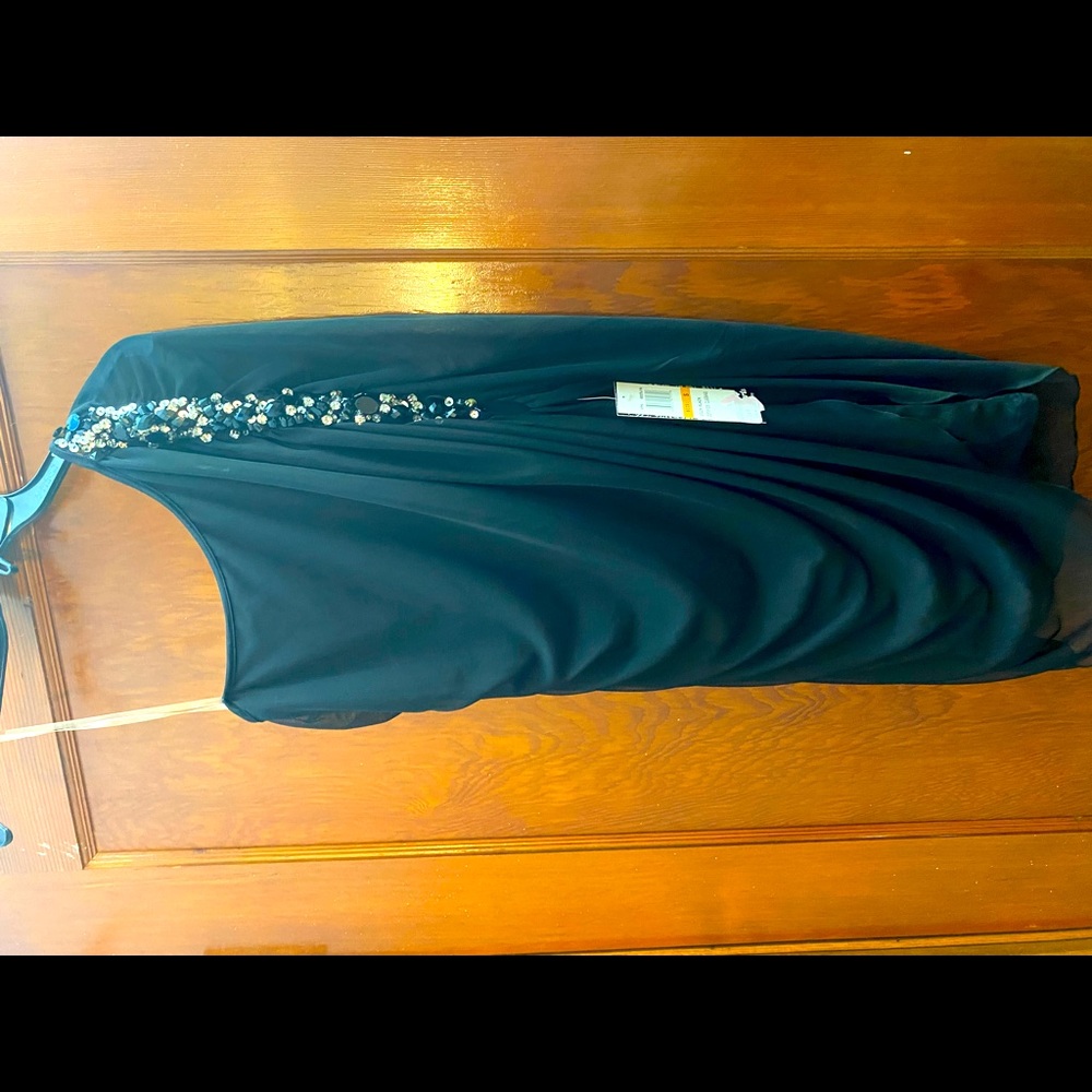 Off the shoulder cocktail dress. Brand new. Black with beading. Smoke free home